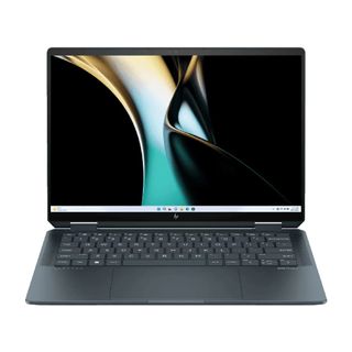 An open and powered on laptop against a white background.
